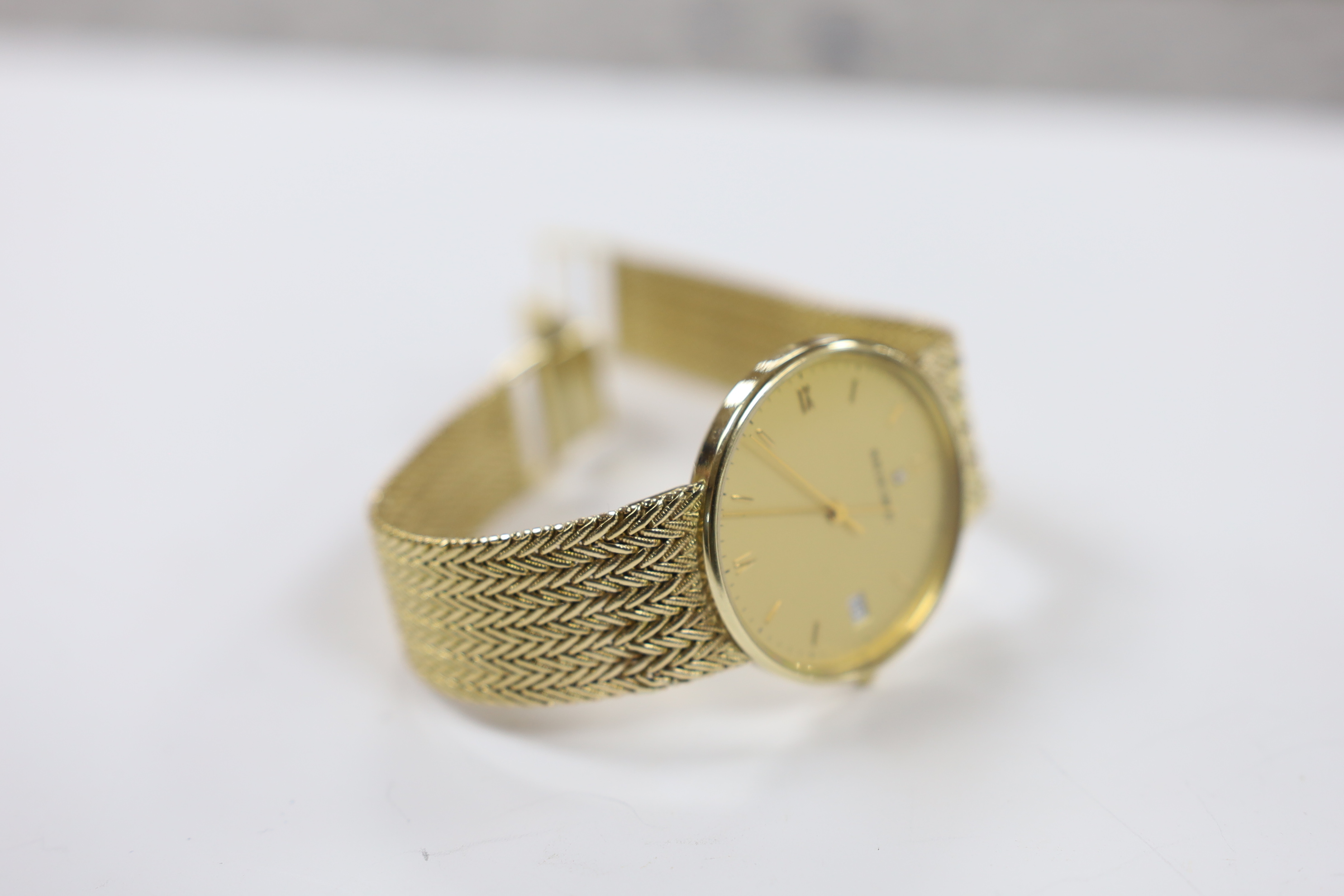 A gentleman's 9ct gold Bueche Girod quartz dress wrist watch, on integral 9ct gold chevron link bracelet, overall length 20.3cm, gross weight 51.8 grams.
